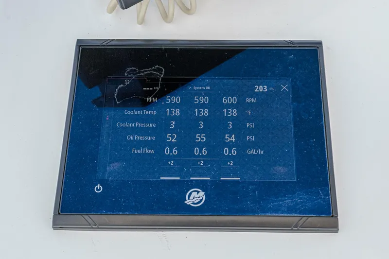 Slide: The Image of Digital display panel on a 2019 Fountain 38 CC boat showing engine metrics. - 11