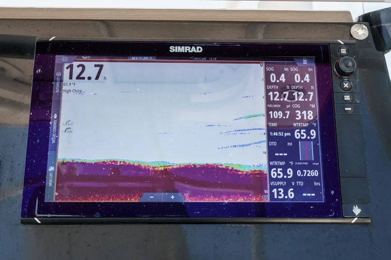 Slide: The Image of Simrad marine display on 2019 Fountain 38 CC showing depth and water temperature. - 17