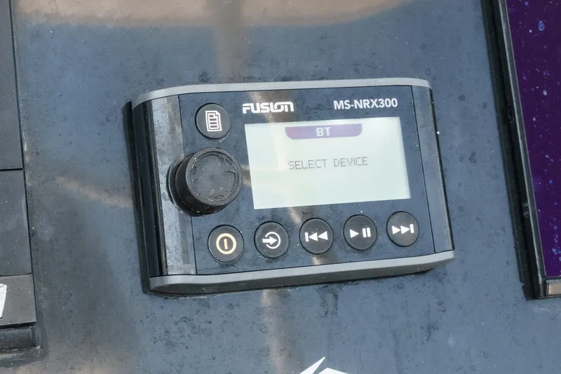 Slide: The Image of Fusion MS-NRX300 audio control panel on 2019 Fountain 38 CC boat. - 19