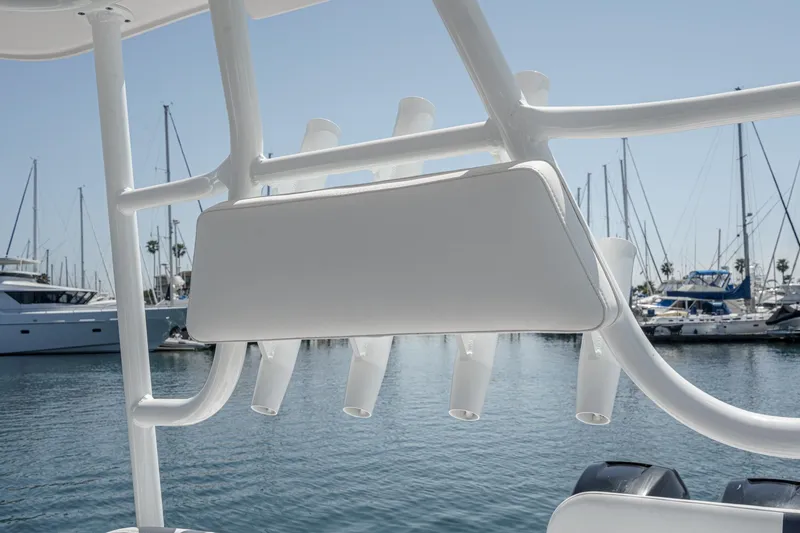 Slide: The Image of 2019 Fountain 38 CC boat with rod holders, docked in a marina. - 22