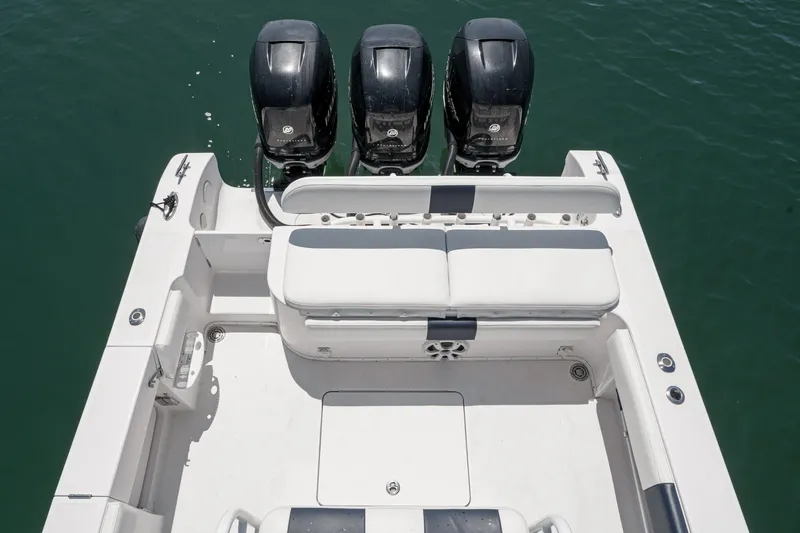 Slide: The Image of 2019 Fountain 38 CC boat with four outboard engines and spacious seating area. - 27