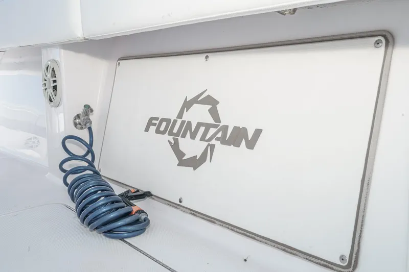 Slide: The Image of 2019 Fountain 38 CC boat interior with coiled hose and logo. - 29