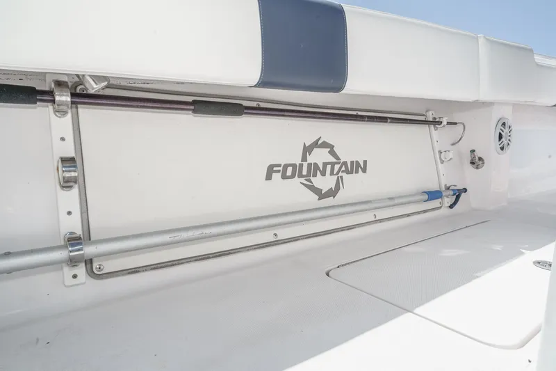 Slide: The Image of 2019 Fountain 38 CC boat interior with rod holders and logo. - 30
