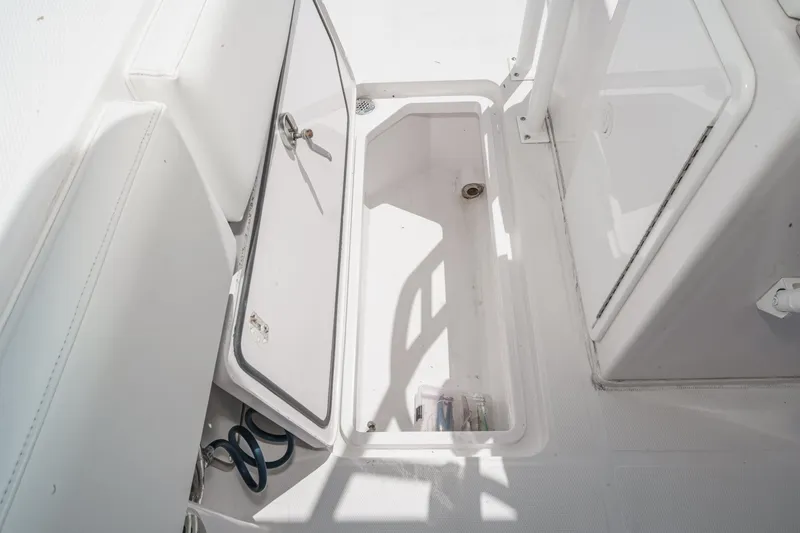 Slide: The Image of Open storage compartment on 2019 Fountain 38 CC boat deck. - 34