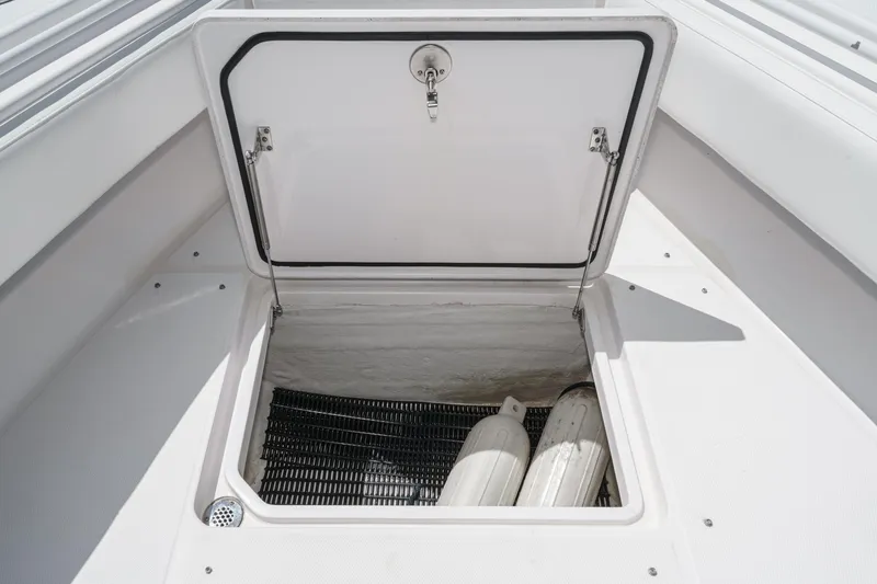 Slide: The Image of Open storage compartment on 2019 Fountain 38 CC boat deck. - 37