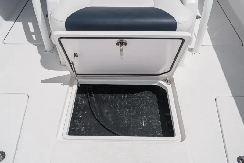Slide: The Image of 2019 Fountain 38 CC boat storage compartment with open hatch. - 39