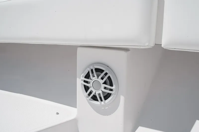 Slide: The Image of Speaker on 2019 Fountain 38 CC boat, integrated into white seating area. - 42