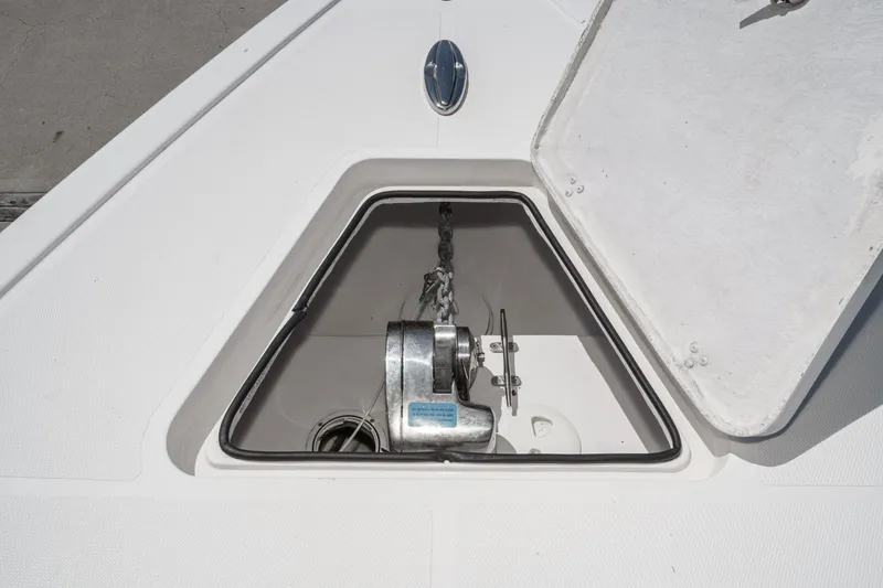 Slide: The Image of Anchor compartment of 2019 Fountain 38 CC boat with open hatch. - 44