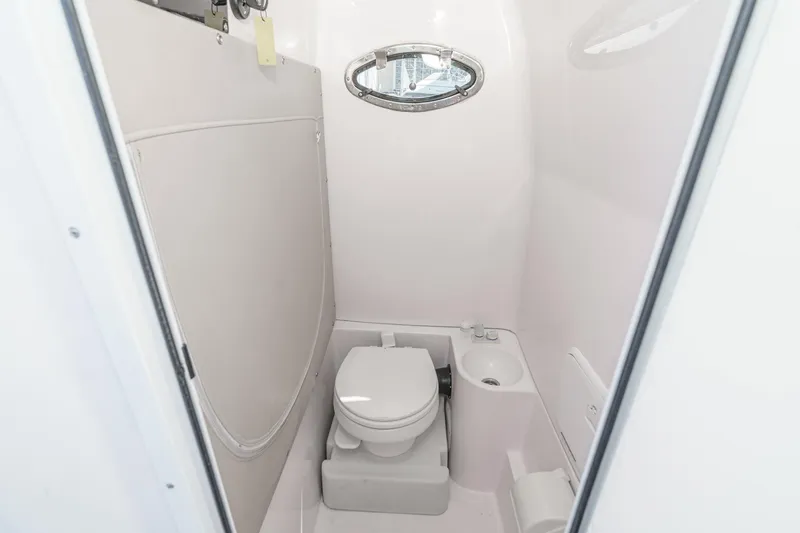 Slide: The Image of Compact bathroom in 2019 Fountain 38 CC boat with toilet and sink. - 45