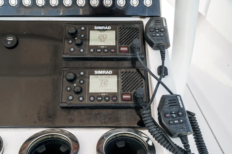 Slide: The Image of Simrad marine radios on 2019 Fountain 38 CC boat dashboard. - 48