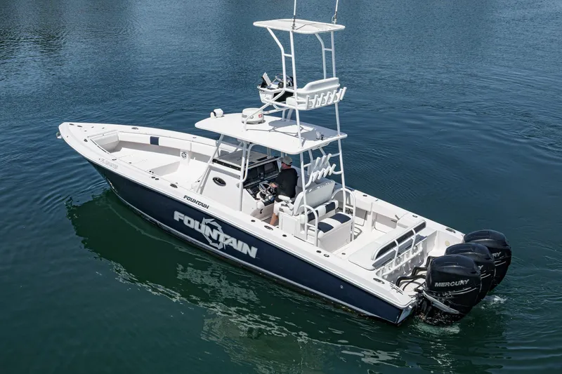Slide: The Image of 2019 Fountain 38 CC boat with triple Mercury engines on calm water. - 6