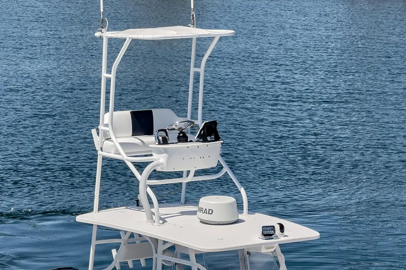 Slide: The Image of 2019 Fountain 38 CC boat with elevated helm station on calm water. - 8