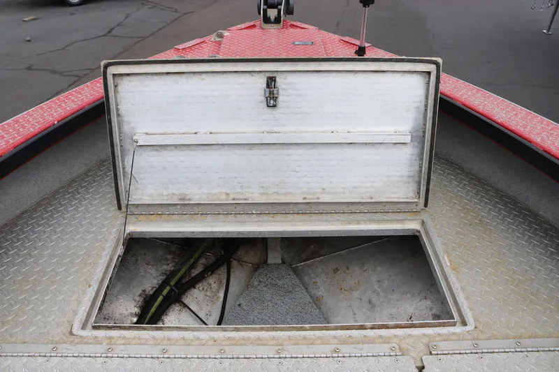 Slide: The Image of Open storage compartment on 2026 North River SCOUT boat deck. - 10
