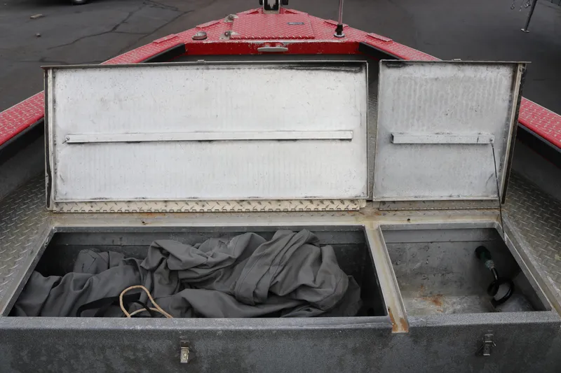 Slide: The Image of Open storage compartment on a 2026 North River SCOUT boat, showing interior details. - 11