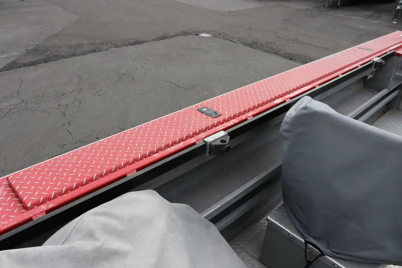 Slide: The Image of 2026 North River SCOUT boat with red diamond plate flooring and covered seats. - 12