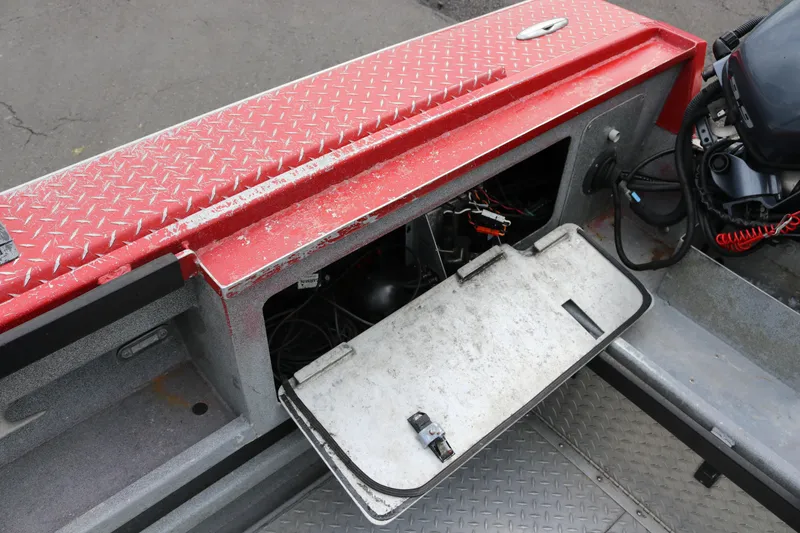 Slide: The Image of Open storage compartment on a 2026 North River SCOUT boat with visible wiring. - 15