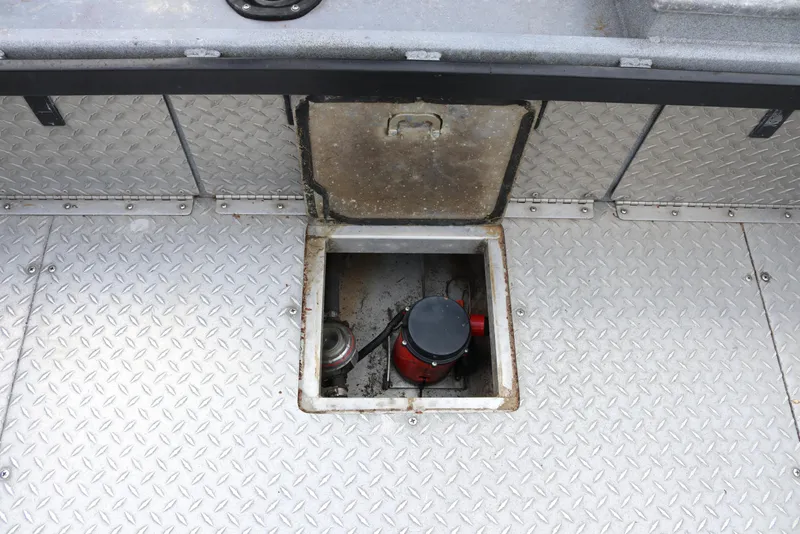 Slide: The Image of Open hatch on 2026 North River SCOUT boat with visible equipment inside. - 17