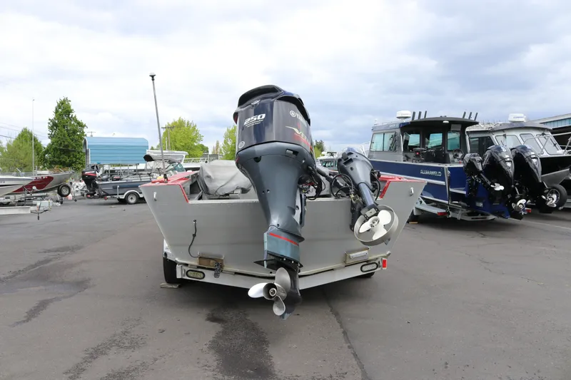 Slide: The Image of 2026 North River SCOUT boat with powerful outboard motors in a marina setting. - 4