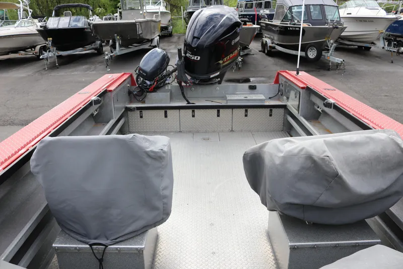 Slide: The Image of 2026 North River SCOUT boat interior with covered seats and powerful outboard motor. - 6