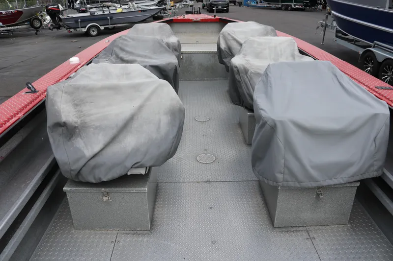 Slide: The Image of 2026 North River SCOUT boat interior with covered seats and metal flooring. - 9