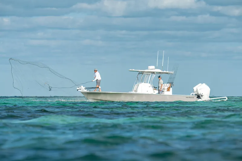 Slide: The Image of 2026 Valhalla Boatworks V-28 Bay fishing in open water, casting net. - 6