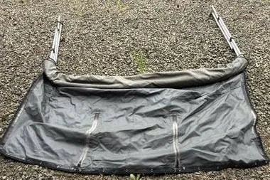 Slide: The Image of 2004 Alumaweld STRYKER 19 boat cover on gravel surface. - 10