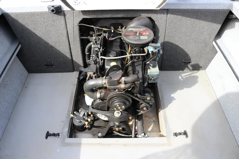 Slide: The Image of 2004 Alumaweld STRYKER 19 boat engine compartment with Mercury 3.0 motor. - 11