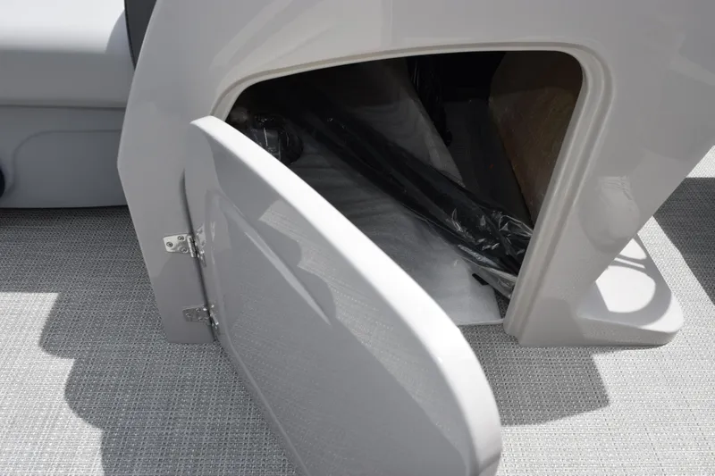 Slide: The Image of Open storage compartment in 2026 Bentley Pontoons Legacy 223 Navigator boat. - 14