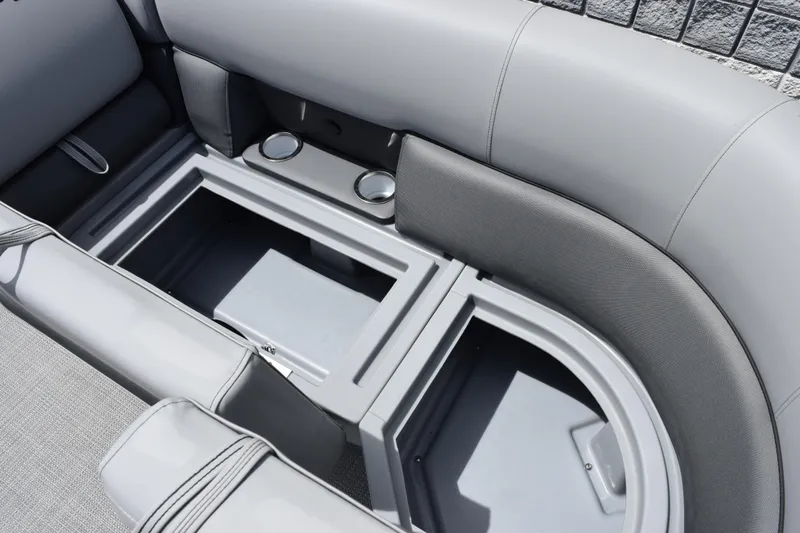 Slide: The Image of 2026 Bentley Pontoons Legacy 223 Navigator interior storage compartments with cup holders. - 15