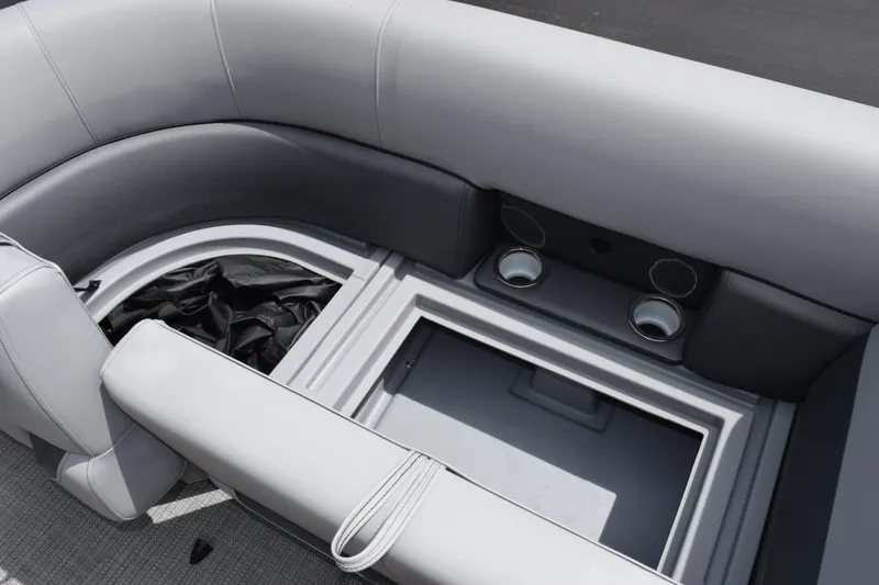 Slide: The Image of 2026 Bentley Pontoons Legacy 223 Navigator interior seating with storage and cup holders. - 16
