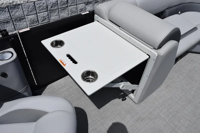 Slide: The Image of 2026 Bentley Pontoons Legacy 223 Navigator interior with foldable table and cup holders. - 19