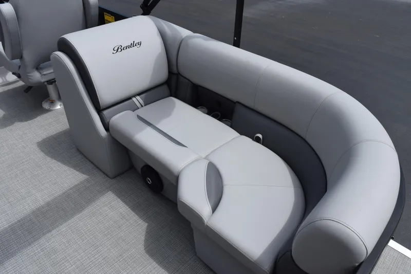 Slide: The Image of Luxurious seating on 2026 Bentley Pontoons Legacy 223 Navigator, featuring elegant gray upholstery. - 8