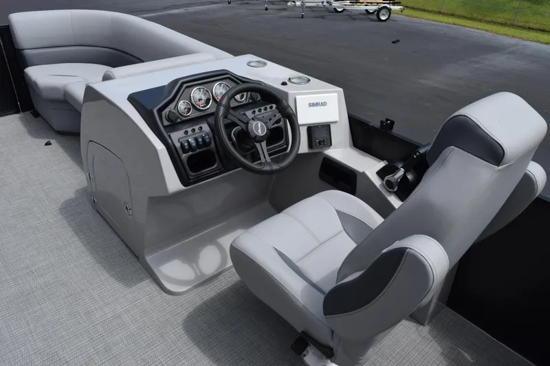 Slide: The Image of 2026 Bentley Pontoons Legacy 223 Navigator helm with modern controls and comfortable seating. - 9