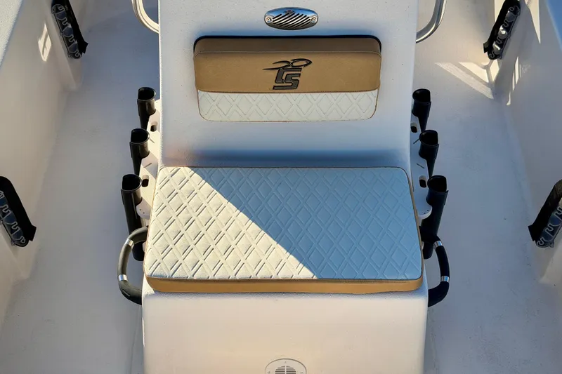 Slide: The Image of 2026 Carolina Skiff E16 JVX CC boat seat with diamond-patterned upholstery and rod holders. - 11