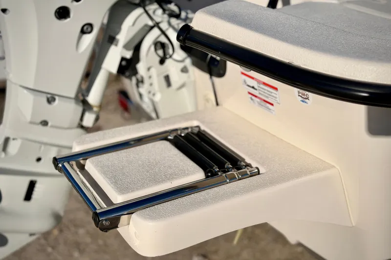 Slide: The Image of 2026 Carolina Skiff E16 JVX CC boat ladder and motor detail. - 4