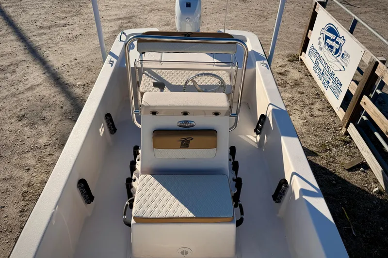 Slide: The Image of 2026 Carolina Skiff E16 JVX CC boat interior with seating and steering console. - 9