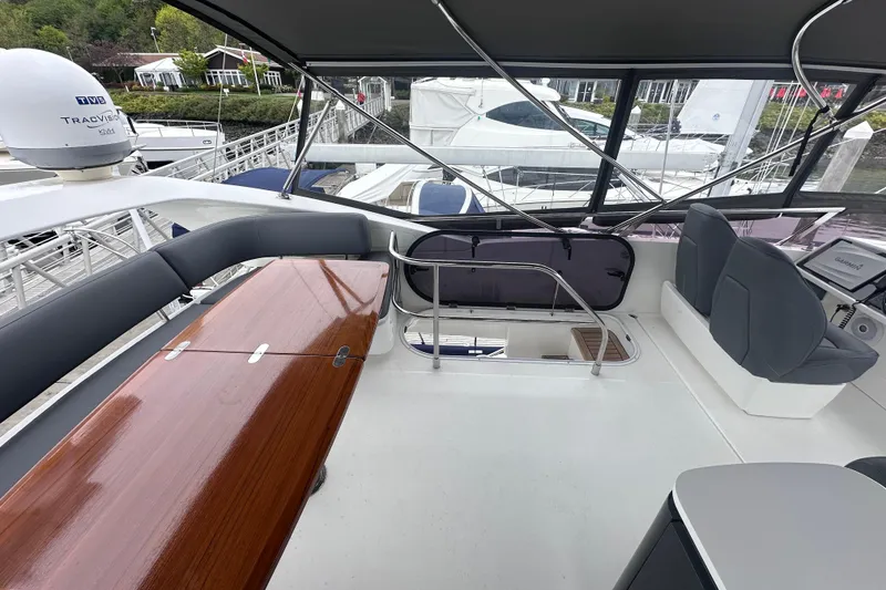 Slide: The Image of Flybridge of 2018 Princess F43 yacht with seating and navigation equipment. - 18
