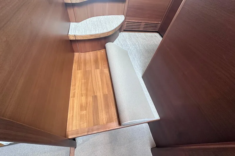 Slide: The Image of Interior of 2018 Princess F43 yacht with wooden flooring and cushioned seating. - 22