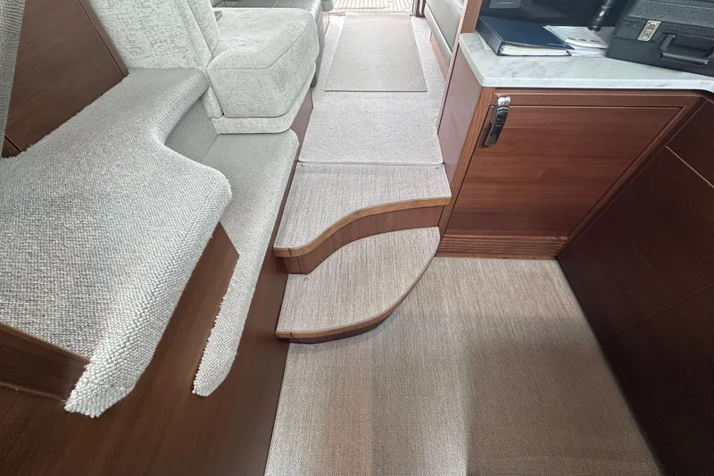 Slide: The Image of Luxurious interior of 2018 Princess F43 yacht with plush seating and elegant wood finishes. - 24