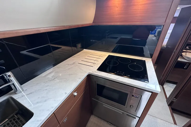 Slide: The Image of Modern kitchen in 2018 Princess F43 yacht with marble countertop and sleek appliances. - 35