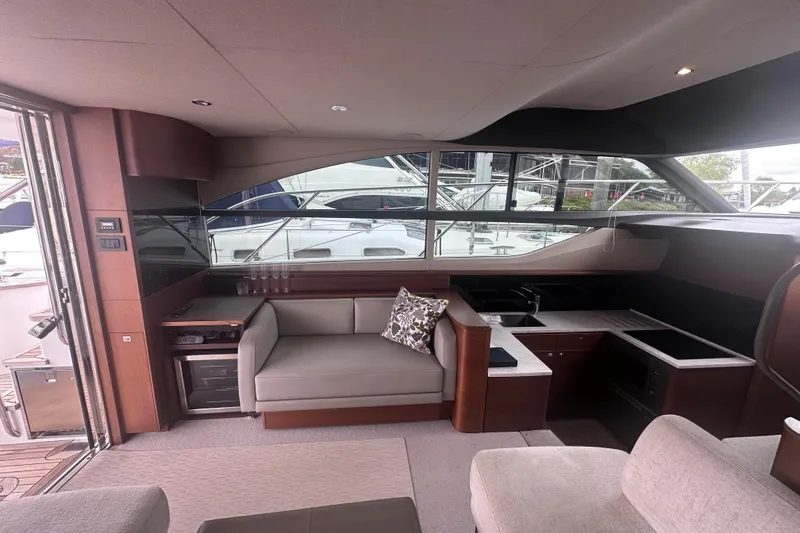 Slide: The Image of Luxurious interior of a 2018 Princess F43 yacht with modern seating and kitchenette. - 37