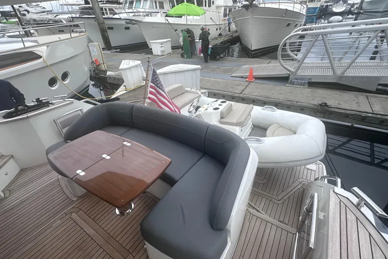Slide: The Image of Luxurious 2018 Princess F43 yacht with elegant seating and American flag at marina. - 40