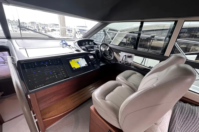 Slide: The Image of Luxurious 2018 Princess F43 yacht cockpit with modern navigation system and plush seating. - 5