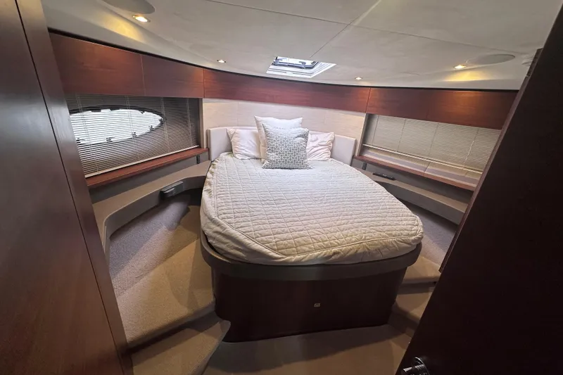 Slide: The Image of Luxurious cabin interior of 2018 Princess F43 yacht with cozy bed and elegant wood finishes. - 6