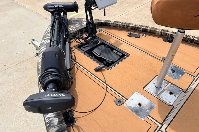 Slide: The Image of 2023 Avid 21 XB Elite boat deck with Garmin trolling motor and fishing seat. - 11