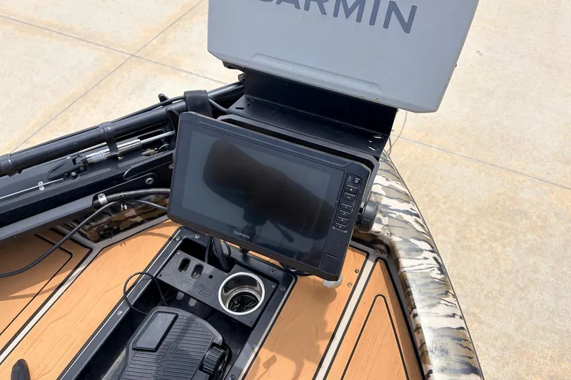 Slide: The Image of 2023 Avid 21 XB Elite boat with Garmin navigation system and foot pedal control. - 14