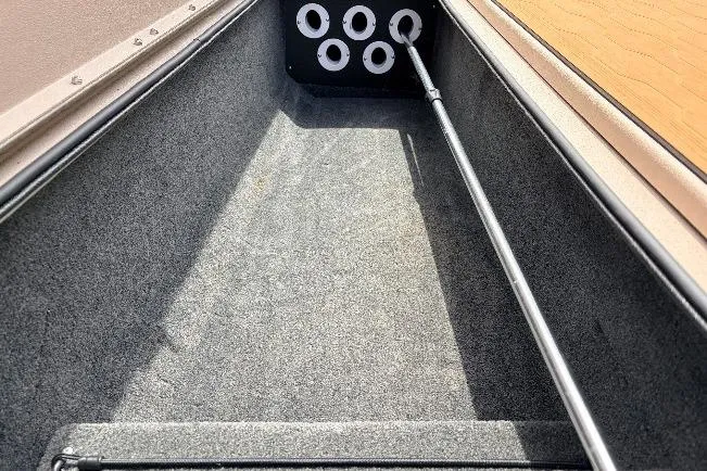 Slide: The Image of Interior view of 2023 Avid 21 XB Elite boat, showcasing storage compartment. - 18