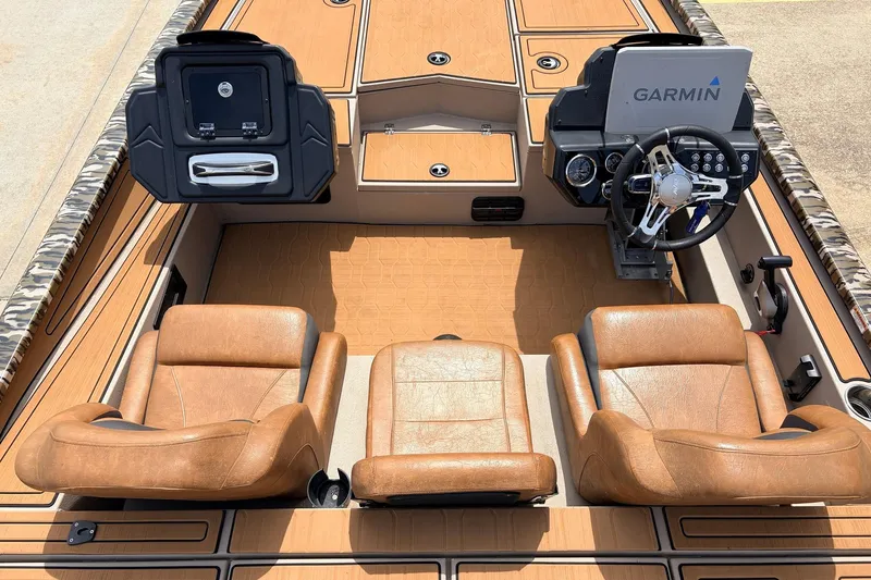 Slide: The Image of 2023 Avid 21 XB Elite boat interior with Garmin navigation system and leather seats. - 31