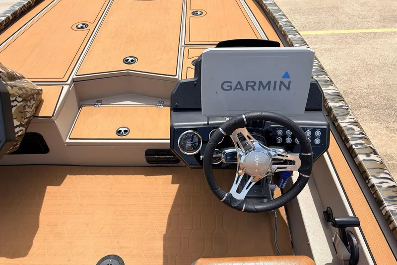 Slide: The Image of 2023 Avid 21 XB Elite boat cockpit with Garmin navigation system and stylish steering wheel. - 35