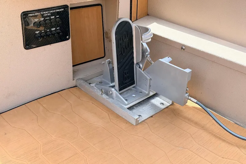 Slide: The Image of Foot pedal and circuit breaker panel in 2023 Avid 21 XB Elite boat interior. - 39